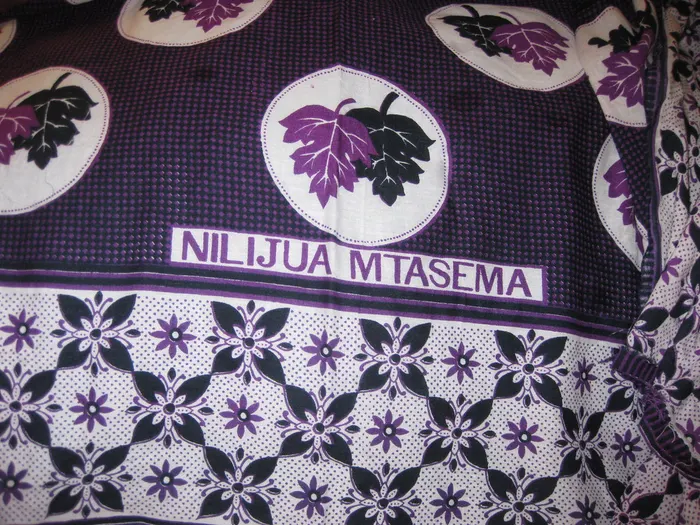 A kanga printed with a Swahili saying